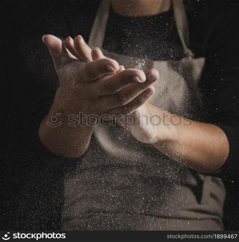 close up baker cleaning hands off flour. Resolution and high quality beautiful photo. close up baker cleaning hands off flour. High quality beautiful photo concept