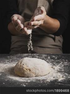 close up baker hands spreading flour. Resolution and high quality beautiful photo. close up baker hands spreading flour. High quality beautiful photo concept