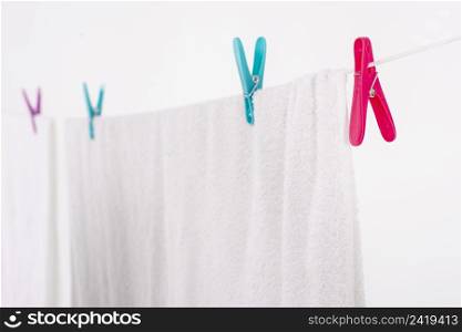 close up bath towel hanging clothesline