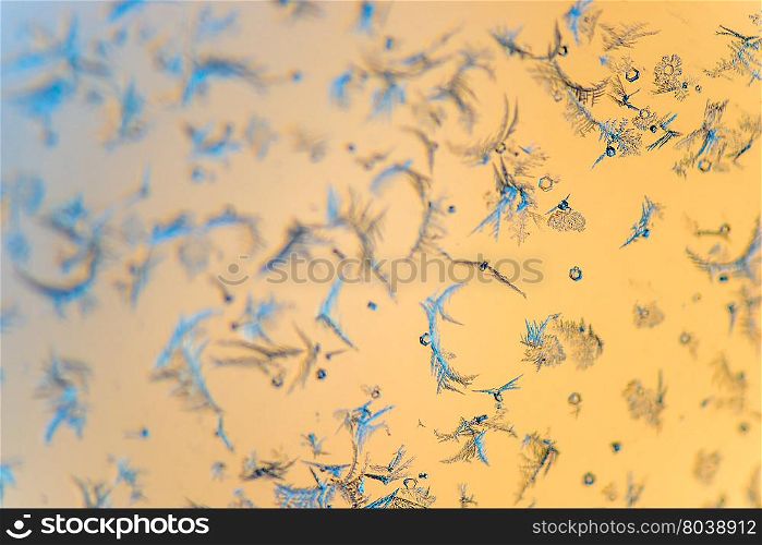 close-up beautiful frosty patterns on a transparent glass