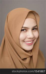 Close up beautiful woman with hijab on gray background