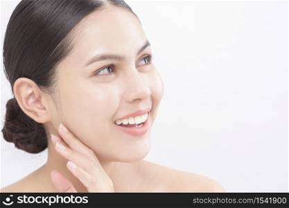 Close up beauty portrait of a young smiling woman isolated over white background studio
