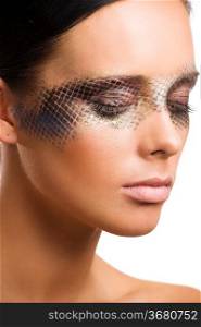 close up beauty portrait of beautiful brunette girl with net faceart over white