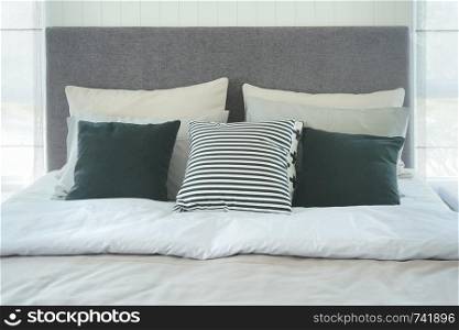 Close up bed with pillows in modern style interior bedroom