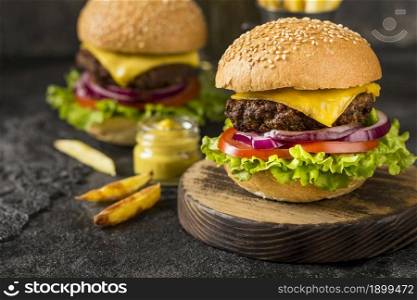 close up beef burgers cutting board with sauce. Resolution and high quality beautiful photo. close up beef burgers cutting board with sauce. High quality beautiful photo concept