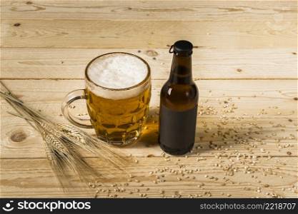 close up beer glass bottle with ears wheat wooden background