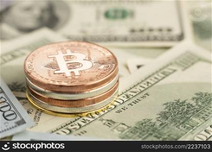 close up bitcoin pile top banknotes