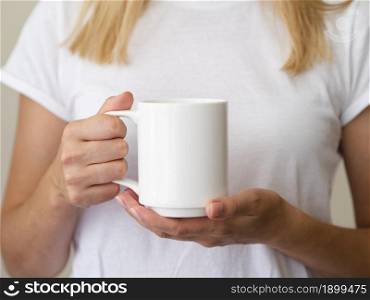 close up blonde woman with mug. Resolution and high quality beautiful photo. close up blonde woman with mug. High quality beautiful photo concept