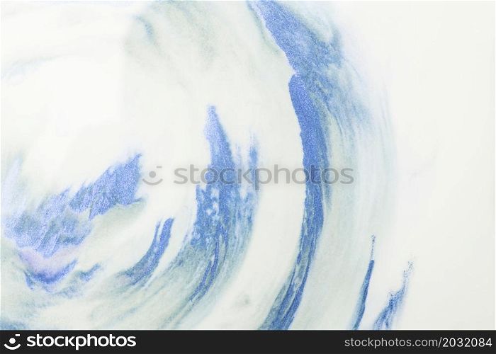 close up blue watercolor strokes white foam background