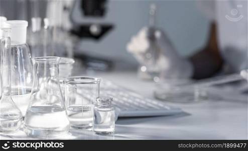 close up blurry researcher holding glassware. Resolution and high quality beautiful photo. close up blurry researcher holding glassware. High quality beautiful photo concept
