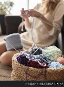 close up blurry woman crocheting