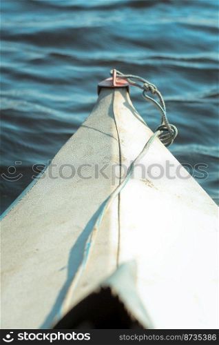 Close up boat bow concept photo. Vessel floating in water. Ship sailing across sea. Front view photography with blurred background. High quality picture for wallpaper, travel blog, magazine, article. Close up boat bow concept photo