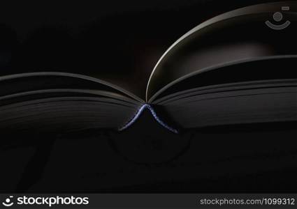 Close up book on table and dark background