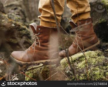 close up boots walking forest
