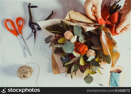 Close up bouquet preparation. Small business concept. Floral bouquet preparation