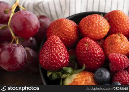 close up bowl with fruits grapes