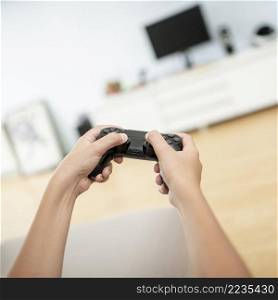 close up boy holding game controller