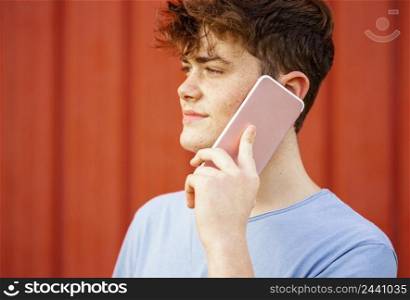 close up boy talking phone