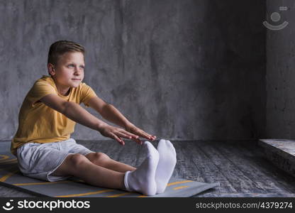 close up boy wearing white socks stretching his hand