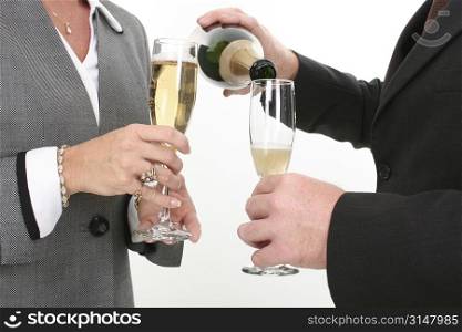 Close-up Business Couple Pouring Champagne.