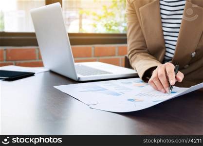 close up business executive working with laptop an data documents in formal uniform at the office
