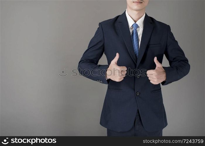 Close up Business man is thumbs up, grey background in studio