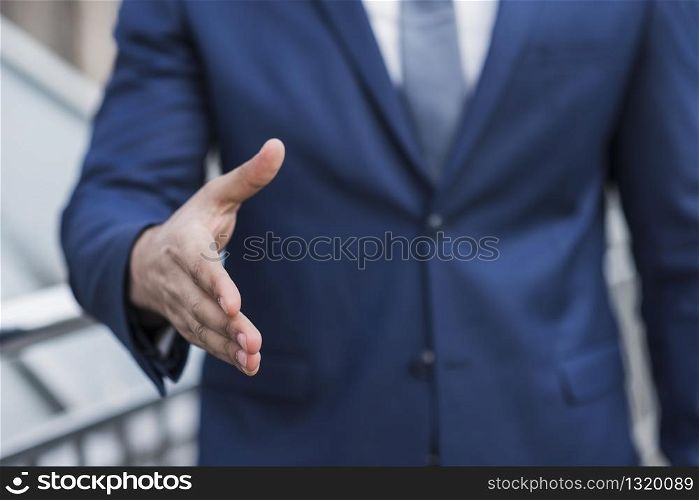 Close-up business man prepared to shake hand