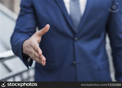 Close-up business man prepared to shake hand