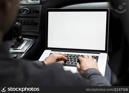 close up businessman s hand using laptop sitting car