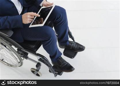 close up businessman s hand wheel wheelchair. High resolution photo. close up businessman s hand wheel wheelchair. High quality photo