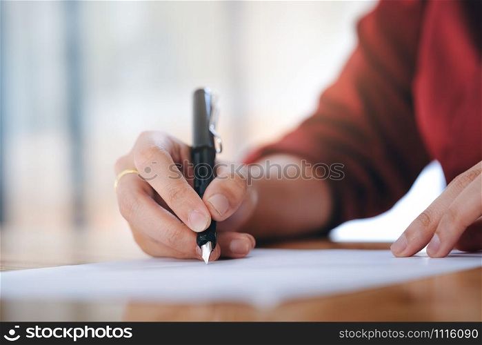Close up businesswoman signing contract making a deal. Business and education concept.