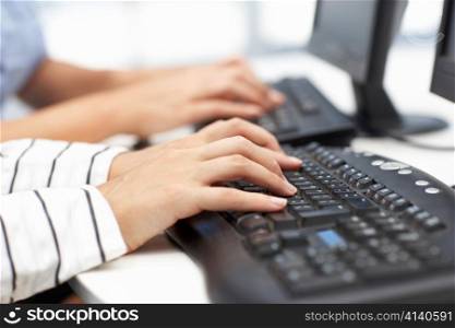 Close up businesswomen typing