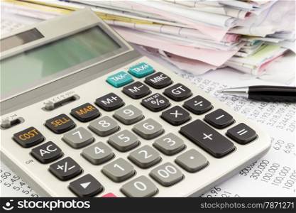 close up calculator on financial summary report