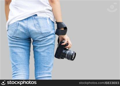 close up camera lens from back side of teeange girl with blue jeans in concept photographer isolate