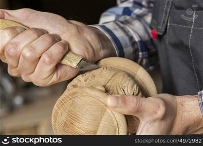 Close up carpenter&rsquo;s hands that work with cutter