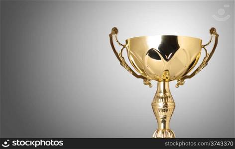 close up champion golden trophy on grey background