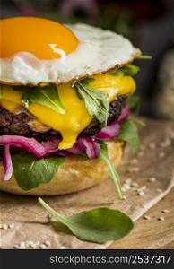 close up cheeseburger with fried egg