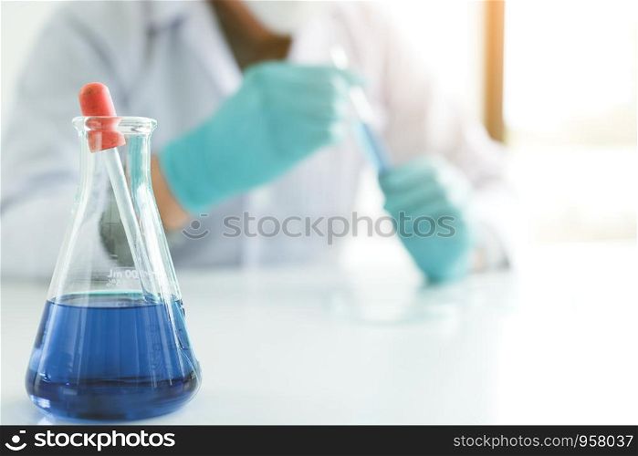 Close up chemical glass tube on table in laboratory.