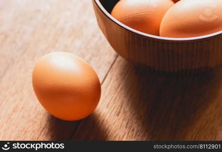 Close up chicken eggs on wooden table