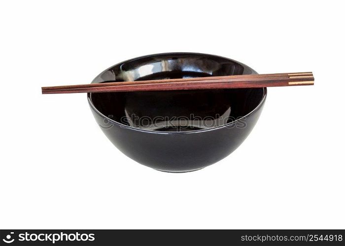 close up chopsticks and black bowl isolated on white.
