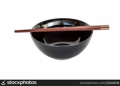 close up chopsticks and black bowl isolated on white.