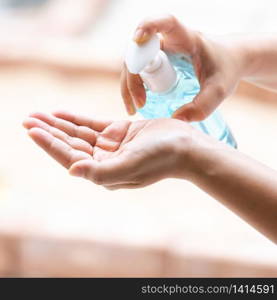 close-up cleaning hand using alocohol gel hand sanitizer waterless in pump bottle, disinfection for safety prevent and protect from infection of virus and germ Covid-19 coronavirus world pandemic.