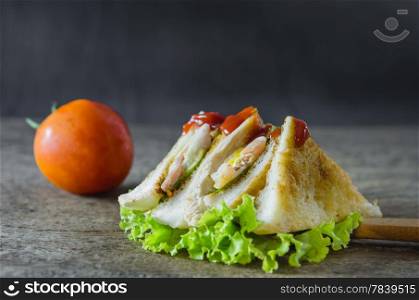 close up club sandwiches with fresh vegetable on wooden table. sandwiches