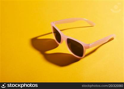 close up colored sunglasses with shadow