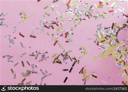 close up colorful confetti pink backdrop