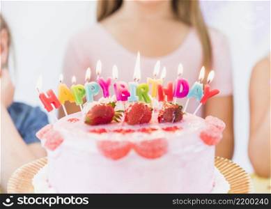 close up colorful glowing birthday candles strawberry topping cake