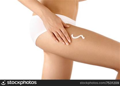 Close up cream drawing on the bared female hip, isolated