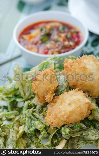 close up crispy shrimp and crispy vegetable served with red chili sauce , asian style cuisine