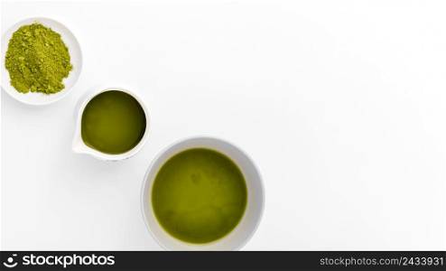 close up cups with matcha powder table