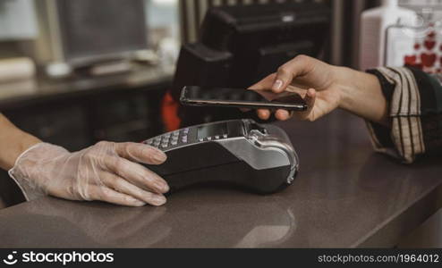 close up customer paying her coffee bill. High resolution photo. close up customer paying her coffee bill. High quality photo